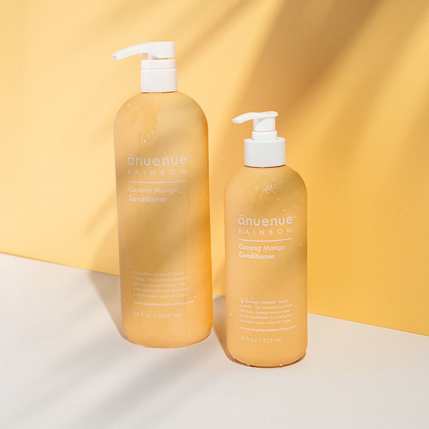 16 and 34 fl oz Coconut Mango Conditioner in yellow bottle