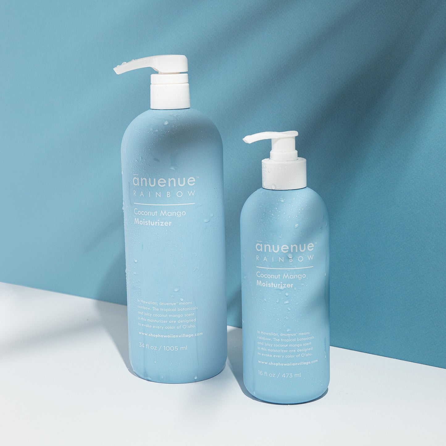 16 and 34 fl oz Coconut Mango Moisturizer in blue bottle